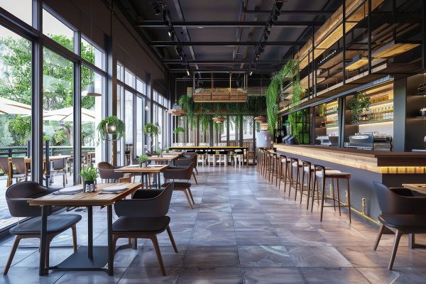 Ein Restaurant mit hohen Wänden von innen, das neu gebaut und schön eingerichtet wurde.